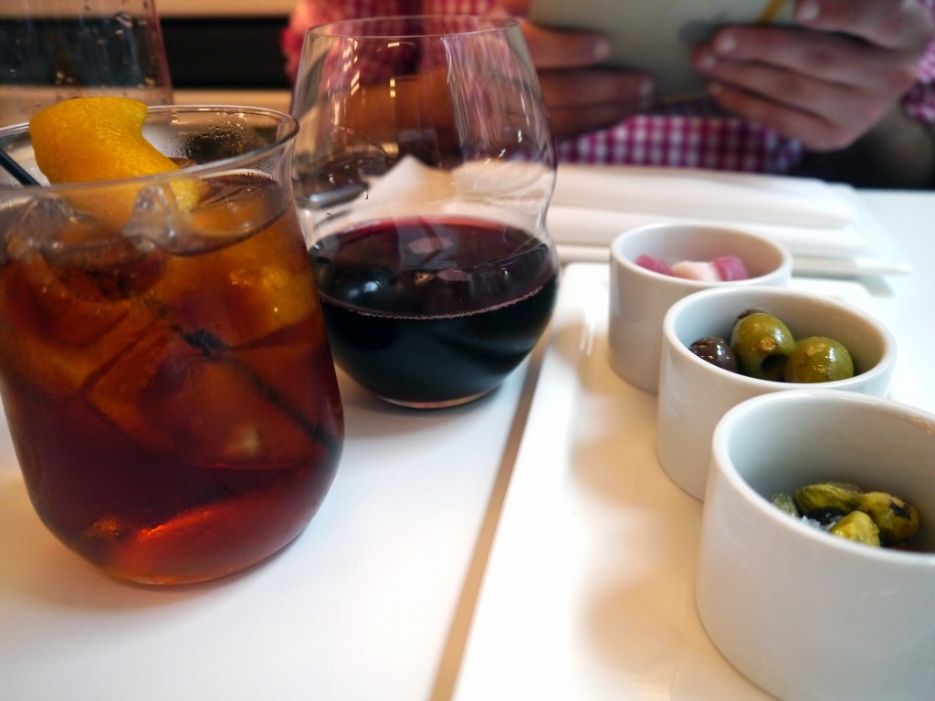 Left: Boulevardier cocktail, Gragnano wine; Right: Pistachios, Olives and Prosciutto