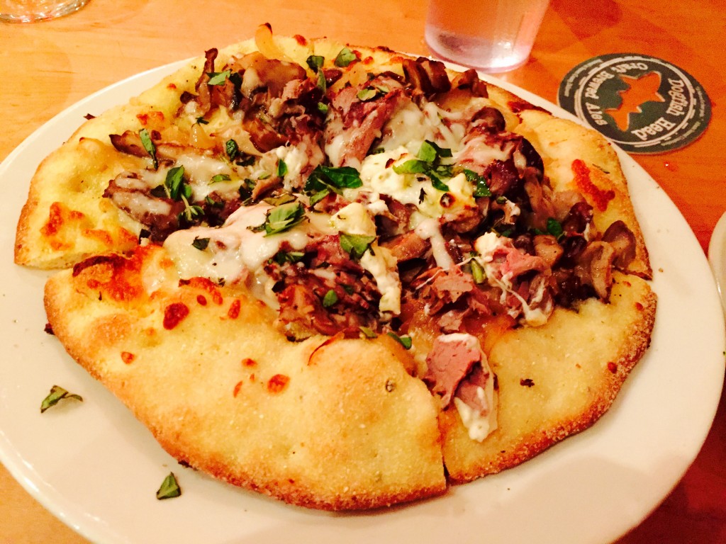The Faithful Bull pizza - beef tenderloin filet, beer braised mushrooms, caramelized onions, Boursin cheese, herbs and roasted garlic.
